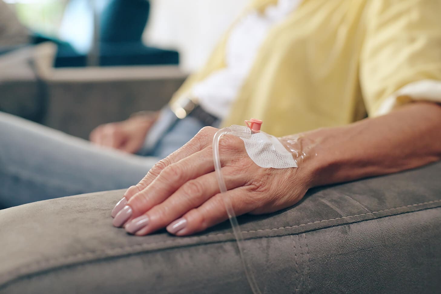 Close-up of a hand with IV line.